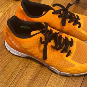 Orange Reebok sneakers